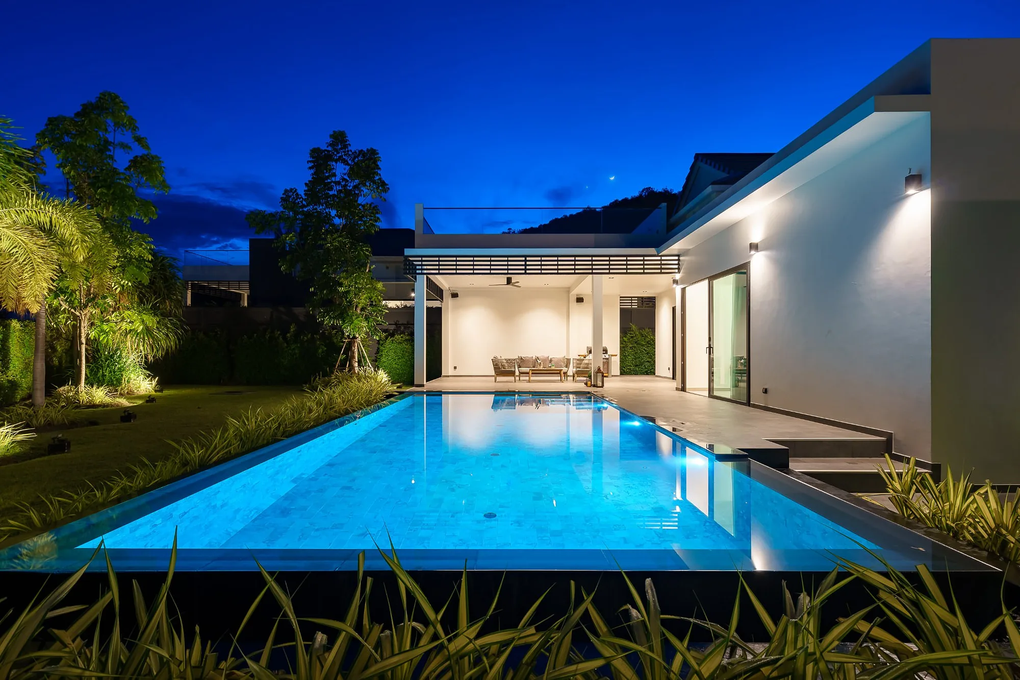 Lit pool at blue hour