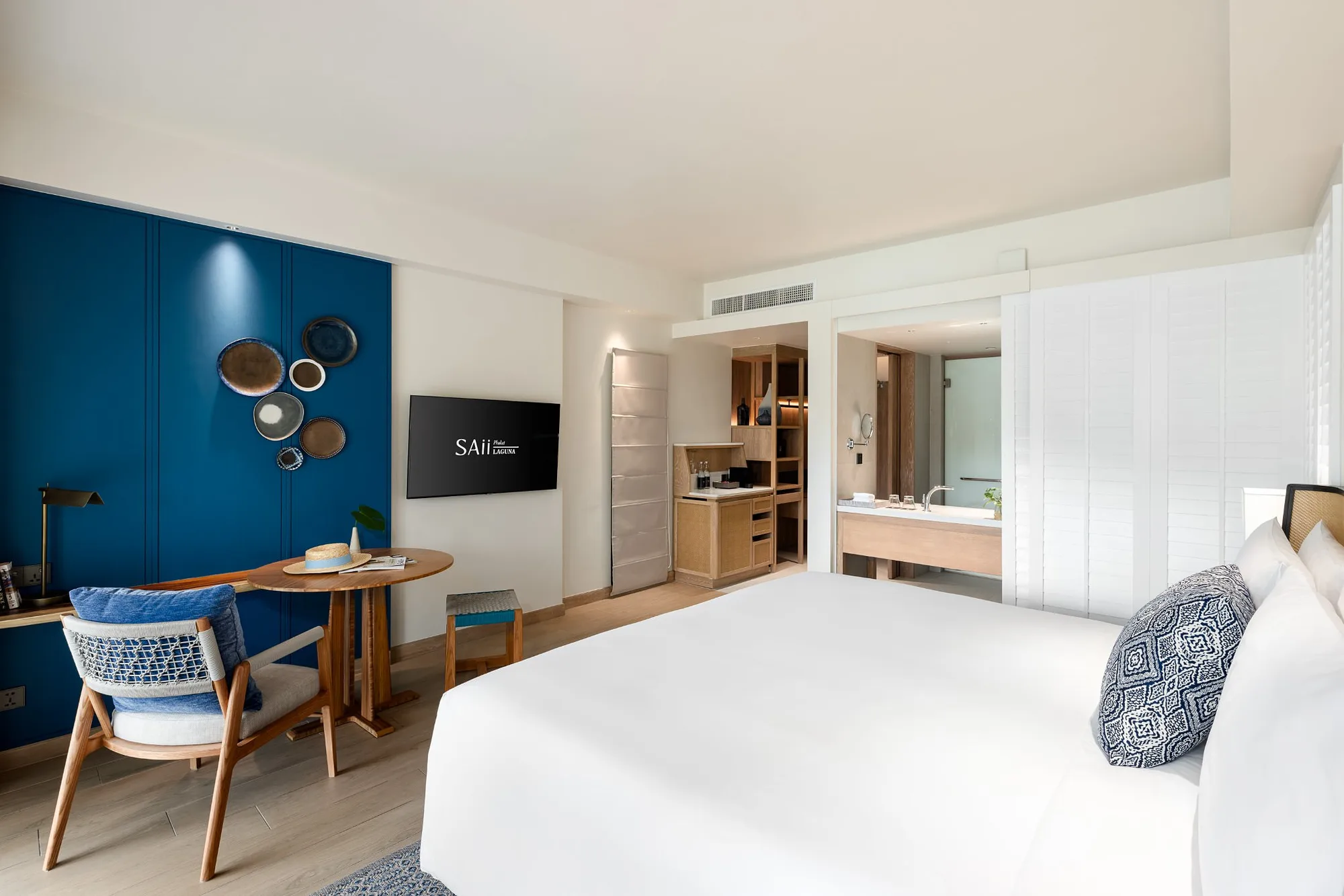 Room with the brand blue feature wall