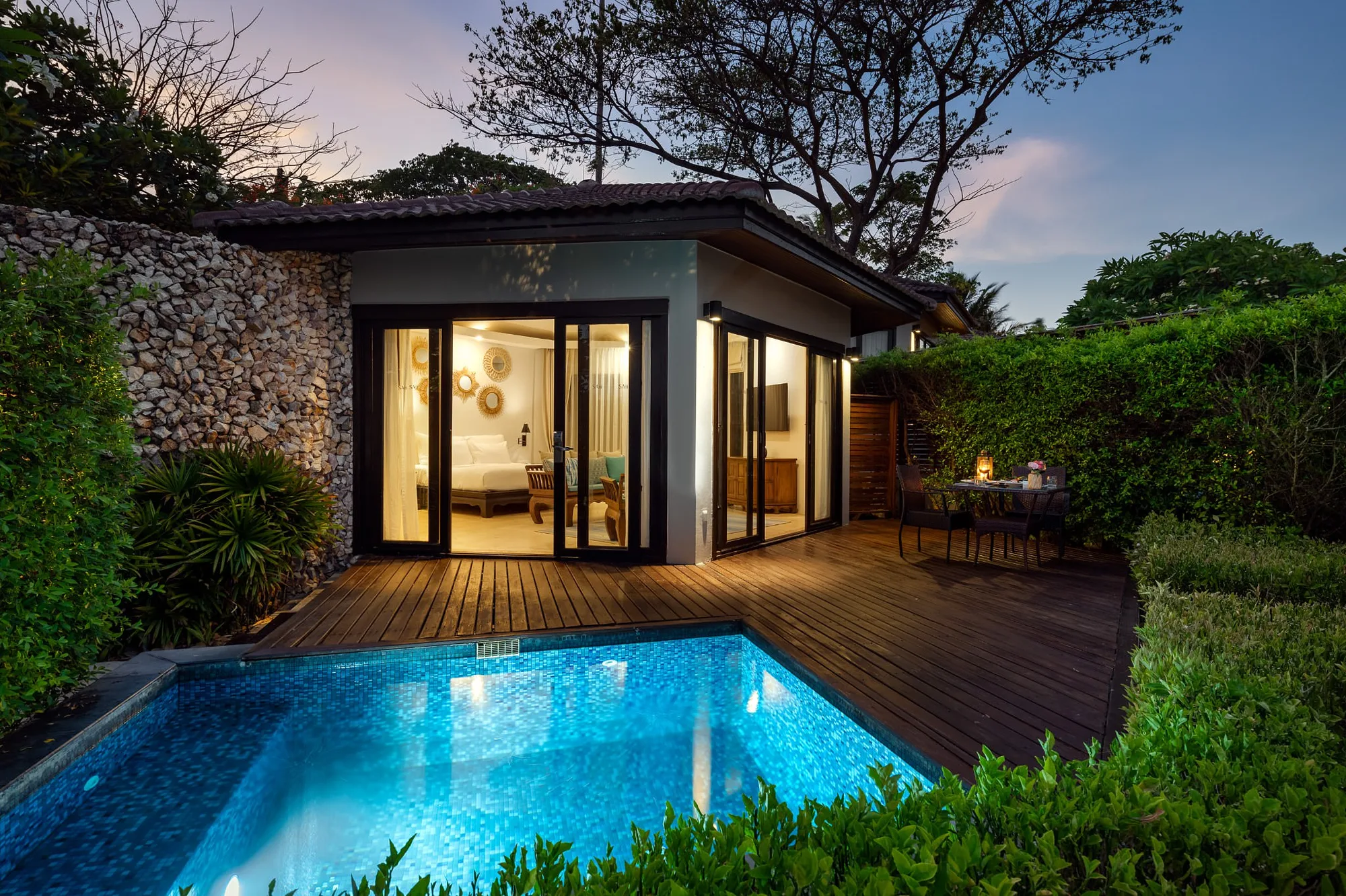 Pool villa lit at night