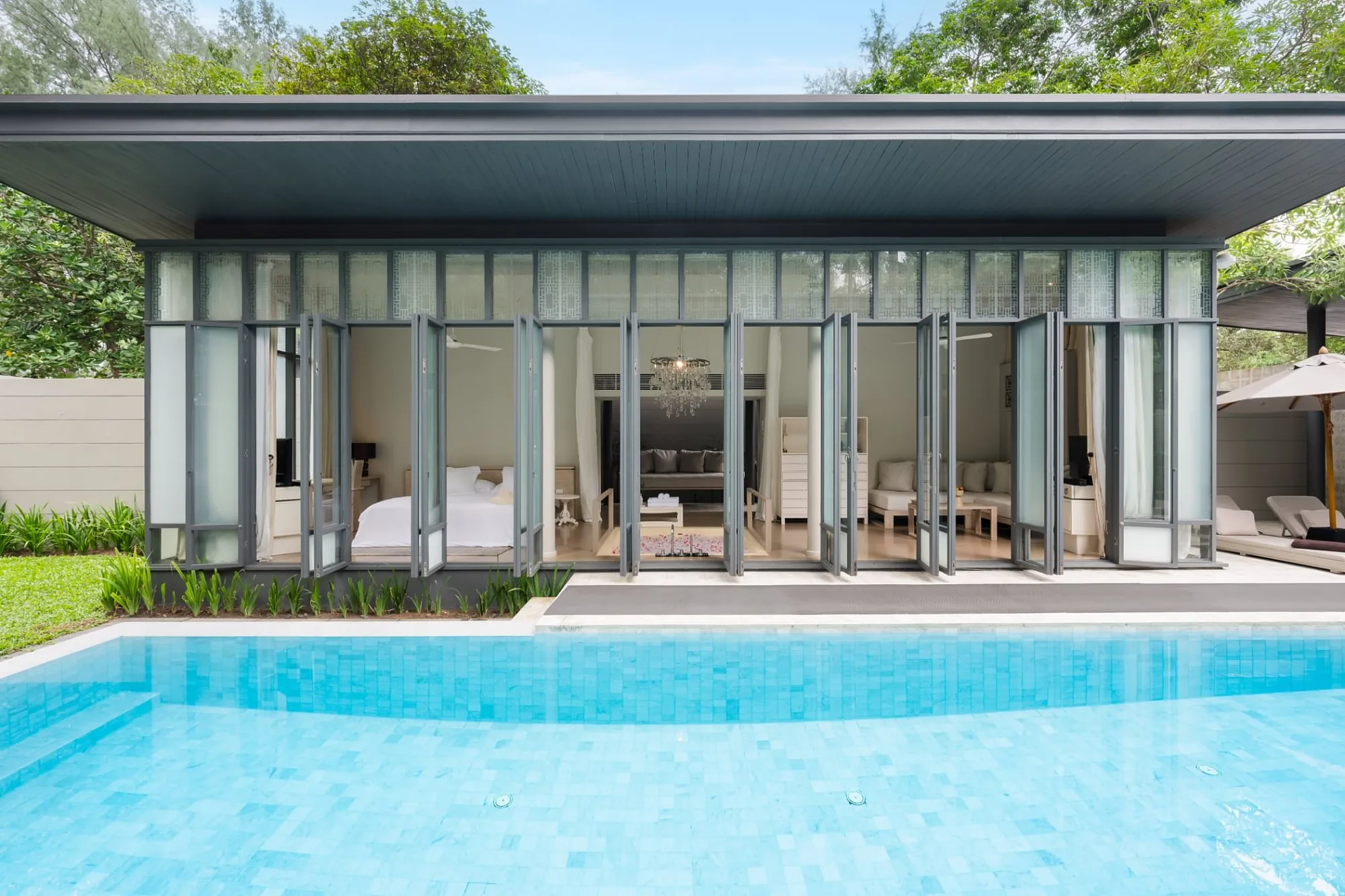 Pool villa exterior with folding glass