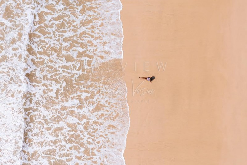 Woman relaxing in empty beach