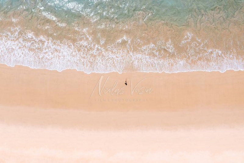 Woman relaxing in empty beach