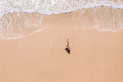 Woman relaxing in empty beach