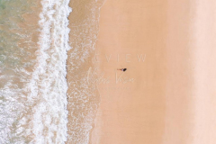 Woman relaxing in empty beach