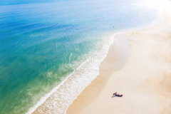 Man relaxing in empty beach in Lamai