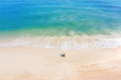 Man relaxing in empty beach in Lamai