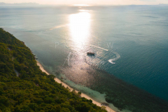 Aerial view Koh Taen sunset with boat