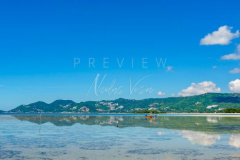 Chaweng beach at low tide with fishing boat