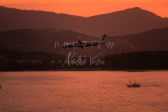 Bangkok airways plane in Samui sunset sky