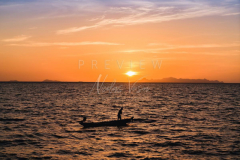 fisherman boat silhouette at sunset