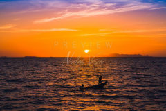 fisherman boat silhouette at sunset