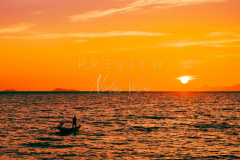 fisherman boat silhouette at sunset