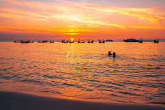 Kids playing at Nathon beach at sunset