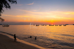 Kids playing at Nathon beach at sunset